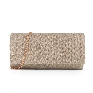 Exquisite glitter pleated clutch bag detail, sparkling evening party accessory with gold chain.