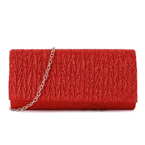 Close-up detail of red glitter pleated evening clutch bag with silver chain strap.
