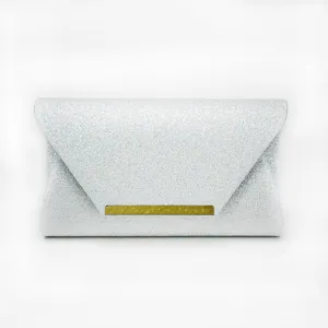 Silver glitter evening clutch bag detail showcasing elegant metallic bar decoration.
