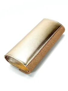 Gold glitter clutch bag detail view, sparkling evening purse closeup, fashion accessory texture.