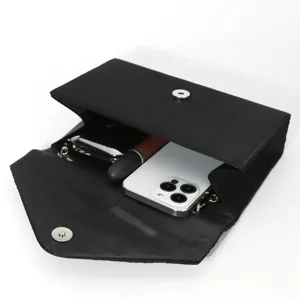 Elegant black evening clutch bag with magnetic snap closure and ample inner space for phone.