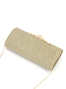 Gold pleated evening clutch bag detail showing metallic clasp and delicate chain strap.