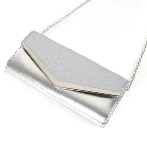 Silver evening clutch bag with glitter flap, V-shaped metallic trim and chain strap.