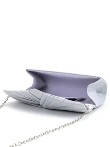 Close-up detail of silver glitter evening clutch bag with pleated design and chain strap.
