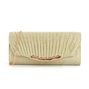 Close-up of gold glitter evening clutch bag with pleated texture and delicate chain strap.