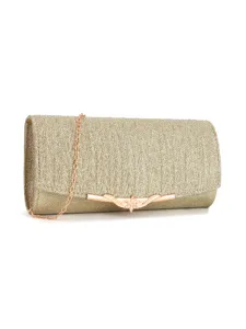 Gold glitter clutch bag close-up showing metallic chain and pleated fabric detail.