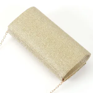 Shimmering gold glitter evening clutch bag for women with elegant chain strap for parties.