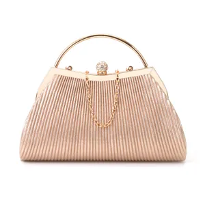 Elegant pleated evening clutch bag with metallic round handle, rhinestones and chain strap.