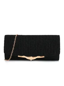 Detailed view of black pleated evening clutch bag with elegant gold chain strap and metal clasp.