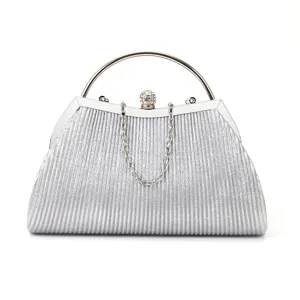 Close-up detail of the silver rhinestone clasp and metallic handle on the elegant evening clutch.