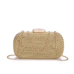 Gold woven evening clutch bag detailed shot showing metallic chain and clasp hardware.
