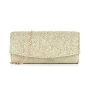 Gold glitter clutch bag detail, sparkling evening handbag fabric texture close up view.