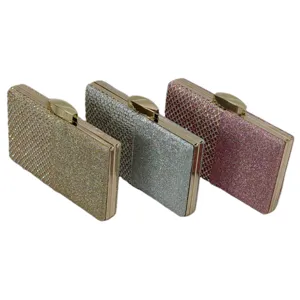Glitter rhinestone evening clutch bags detail view, showing gold, silver and pink variants with metal frames.