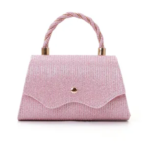 Pink glitter evening handbag with twisted handle and chic design for party and wedding.