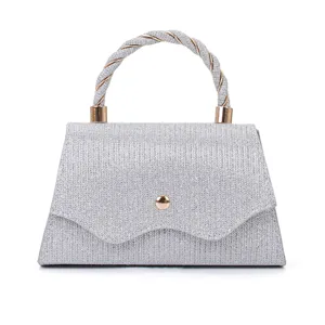 Silver glitter evening handbag with twisted handle and metal clasp for women parties weddings.
