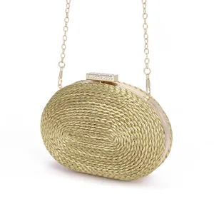 Elegant gold woven oval evening clutch bag with chain strap and crystal clasp for women.