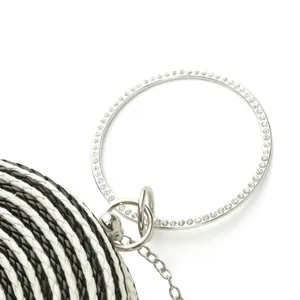Handcrafted black white woven round clutch bag with rhinestone circle handle and chain strap.