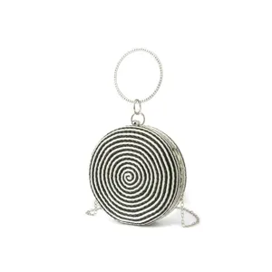 Handmade black and white woven round clutch bag with metal ring handle and chain strap.