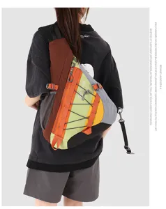 Outdoor sports lightweight sling bag detail view, multi-pocket color block chest backpack.