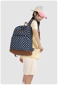 Sac à dos à pois bleu marine pour femme, grand cartable stylé pour le quotidien et les cours.