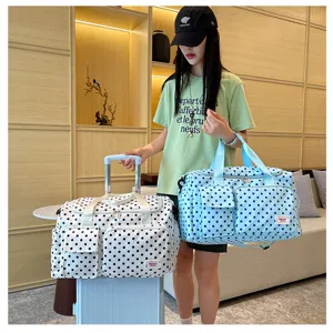 Grand sac de voyage capacite avec housse de trolley, sac weekend a pois elegant.