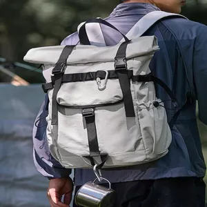 Waterproof roll-top backpack, durable outdoor travel laptop daypack for men and women.