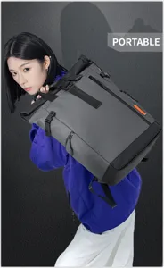Detailed view of grey waterproof oxford cloth roll-top backpack with orange accent.