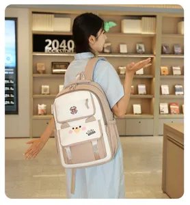 Grand sac à dos étudiant colorblock avec joli design d'ours et poches pratiques pour l'école.