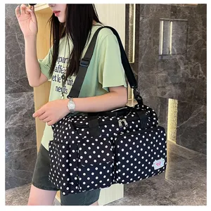 Grand sac de voyage cabine pour femme, motif à pois noirs et blancs, bandoulière.
