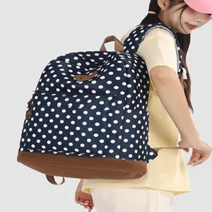 Sac à dos à pois élégant avec fond en cuir, grand sac d'école décontracté pour voyages et travail.