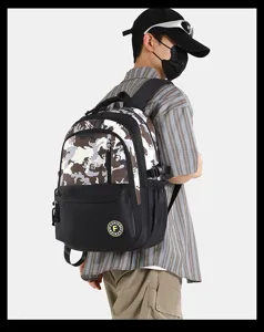 Detail view of the casual color-block backpack with camo pattern and pocket design.