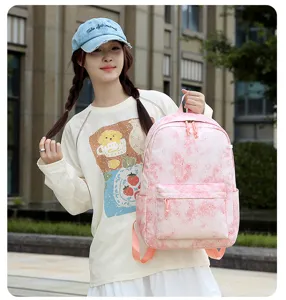 Sac à dos d'école rose dégradé motif étoiles, avec poche avant et bretelles solides.