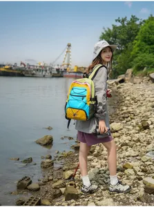Outdoor colorblock travel backpack, lightweight hiking rucksack for men and women, large capacity.