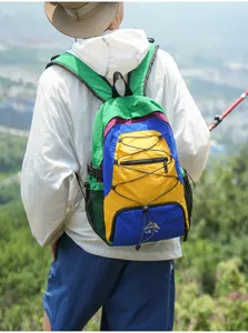 Color-block outdoor travel backpack with large capacity, lightweight design for hiking and use.