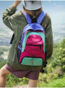 Outdoor travel color-block backpack detail showing vibrant design, straps and mesh pockets.