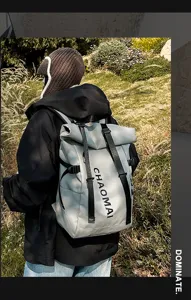 Street fashion roll-top backpack with durable waterproof fabric and adjustable straps for outdoor travel.