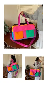 Colorblock travel duffel bag for women, stylish weekend overnight bag with shoulder strap.