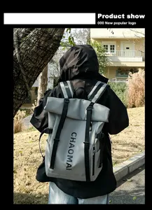 Grey roll-top waterproof backpack for men and women, casual outdoor sports travel bag.