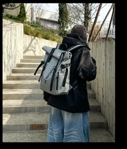 Street fashion roll-top waterproof backpack for outdoor travel, casual sports use.