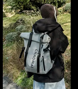 Detail view of the waterproof roll-top streetwear backpack with black straps for outdoor travel.
