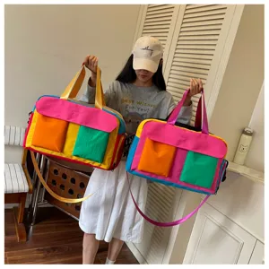 Color-blocked travel duffel bag with multiple pockets for women weekend gym and daily use detail.