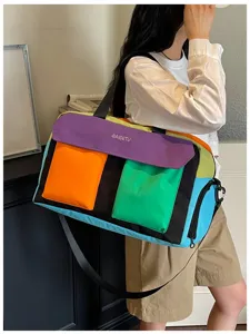 Colorful color-block travel duffel bag for women, spacious fitness and gym shoulder bag.