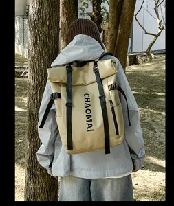 Outdoor casual roll-top backpack detail back view, beige waterproof design with black straps.