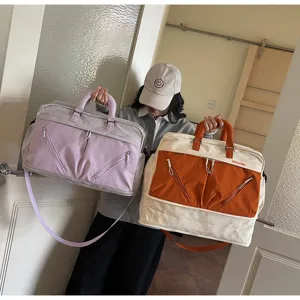 Large capacity expandable travel duffel bag for women, perfect for short trips and gym sports.