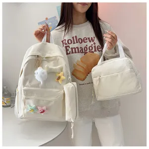 Set zaino in corduroy a tre pezzi con borsa pranzo e astuccio per studenti dettaglio.