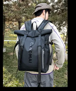Waterproof roll-top backpack for men and women, stylish black outdoor hiking and sports bag.