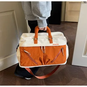 Large capacity travel duffle bag for women, weekend overnight bag with waterproof compartments.