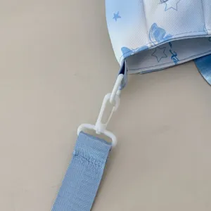 Blauwe verloop canvas rugzak schouderriem detail met mooie sterren en strik print.