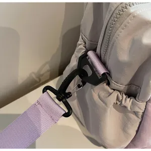 Travel bag strap detail, large capacity luggage bag, durable nylon material, purple.