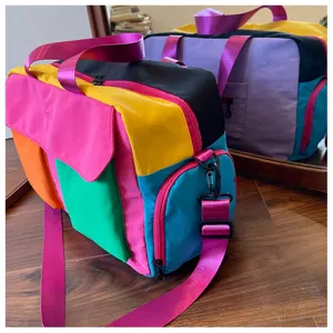 Colorful color-blocked travel duffel bag stylish gym shoulder handbag for women daily use.